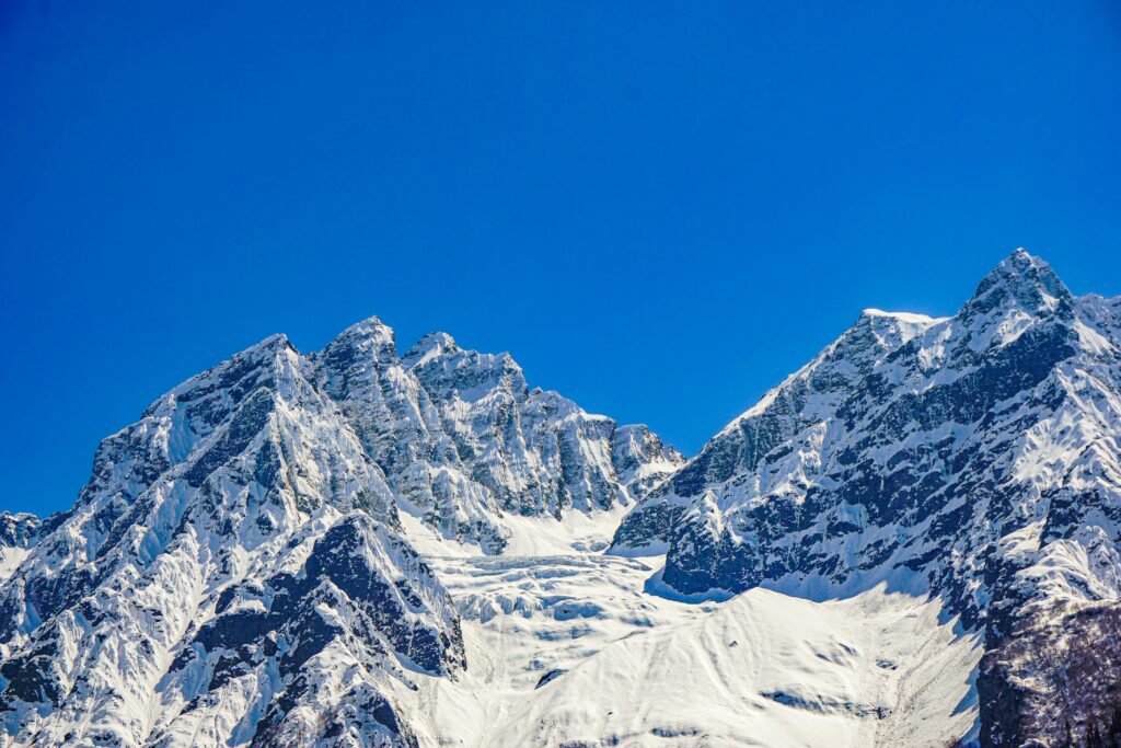 Stunning view of the snow-covered mountains in Sonamarg under a clear blue sky.